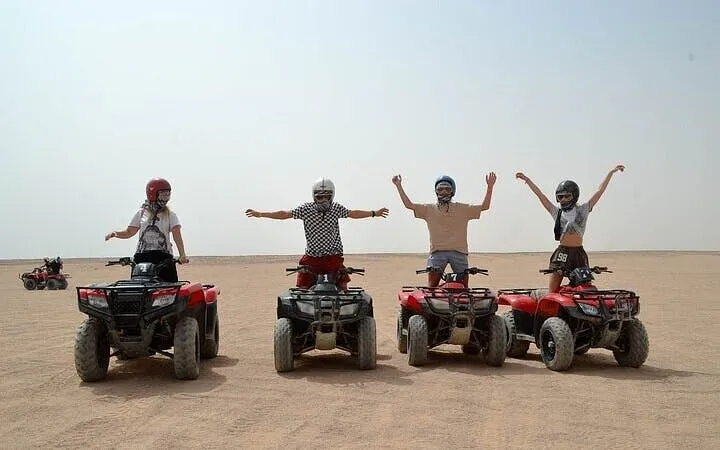 ATV riders in desert at 3 Pools National Park, Dahab, part of Sharm El Sheikh tour.