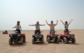 ATV riders in desert at 3 Pools National Park, Dahab, part of Sharm El Sheikh tour.