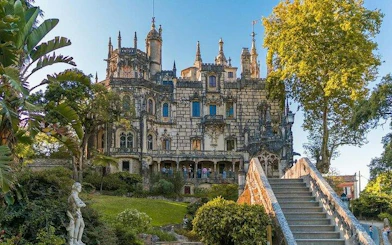 Sintra's Quinta da Regaleira with ornate architecture and lush gardens on a private half-day tour from Lisbon.