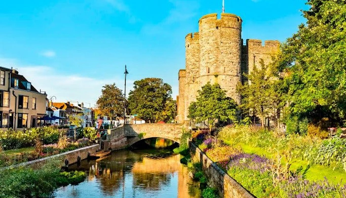 Canterbury cityscape with Westgate Towers and river on self-guided walking tour route.