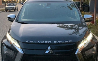 Black Mitsubishi Xpander Cross for Cairo and Giza airport or hotel transfer.
