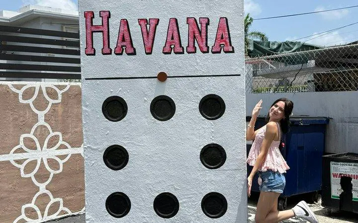 Little Havana domino mural with a visitor in Miami.