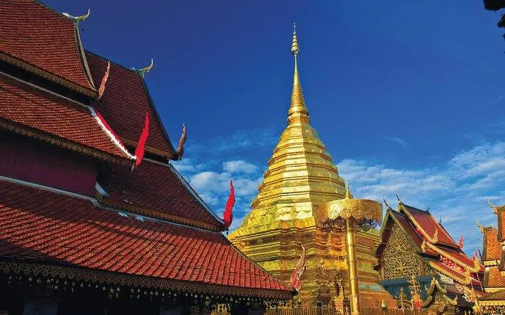 Golden stupa of Doi Suthep Temple under blue sky, Chiang Mai.