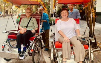 Cyclo riders in Hanoi's Old Quarter during a private tour.