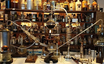 Artisan workshop with glassware and bottles in Florence tour demonstration.