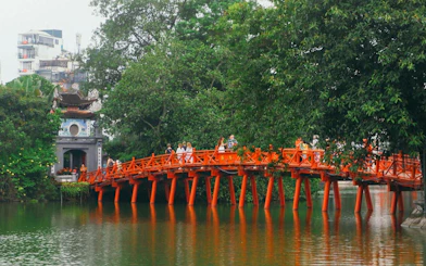 Huc Bridge over Hoan Kiem Lake in Hanoi Old Quarter, part of self-guided audio walking tour.