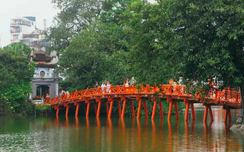 Huc Bridge over Hoan Kiem Lake in Hanoi Old Quarter, part of self-guided audio walking tour.