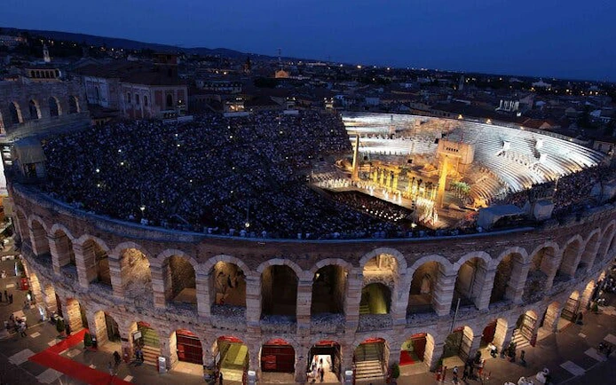 Arena di Verona illuminated at night during an opera performance, Verona, Italy.