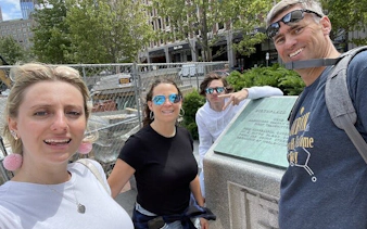 Group exploring historical site in Boston during self-guided city game.