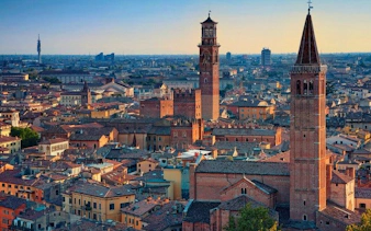 Verona cityscape with Lamberti Tower and historic buildings, view from self-guided walking tour.