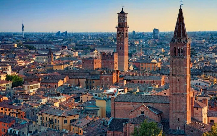 Verona cityscape with Lamberti Tower and historic buildings, view from self-guided walking tour.