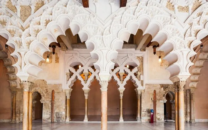 Aljafería Palace arches in Zaragoza, featured on self-guided walking tour app.