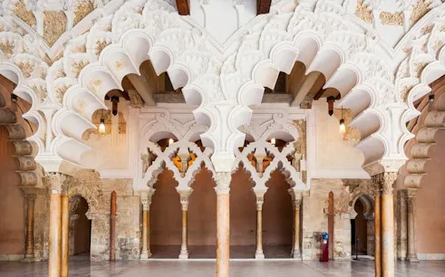 Aljafería Palace arches in Zaragoza, featured on self-guided walking tour app.