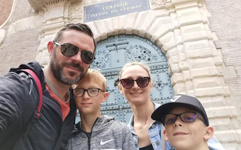 Toulouse Old Town family at Collège Pierre de Fermat entrance.