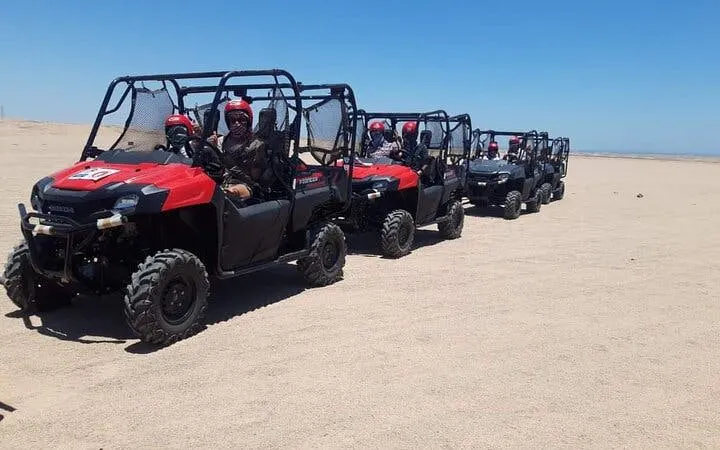 Family riding buggies on desert safari in Sharm El Sheikh's Echo Valley.