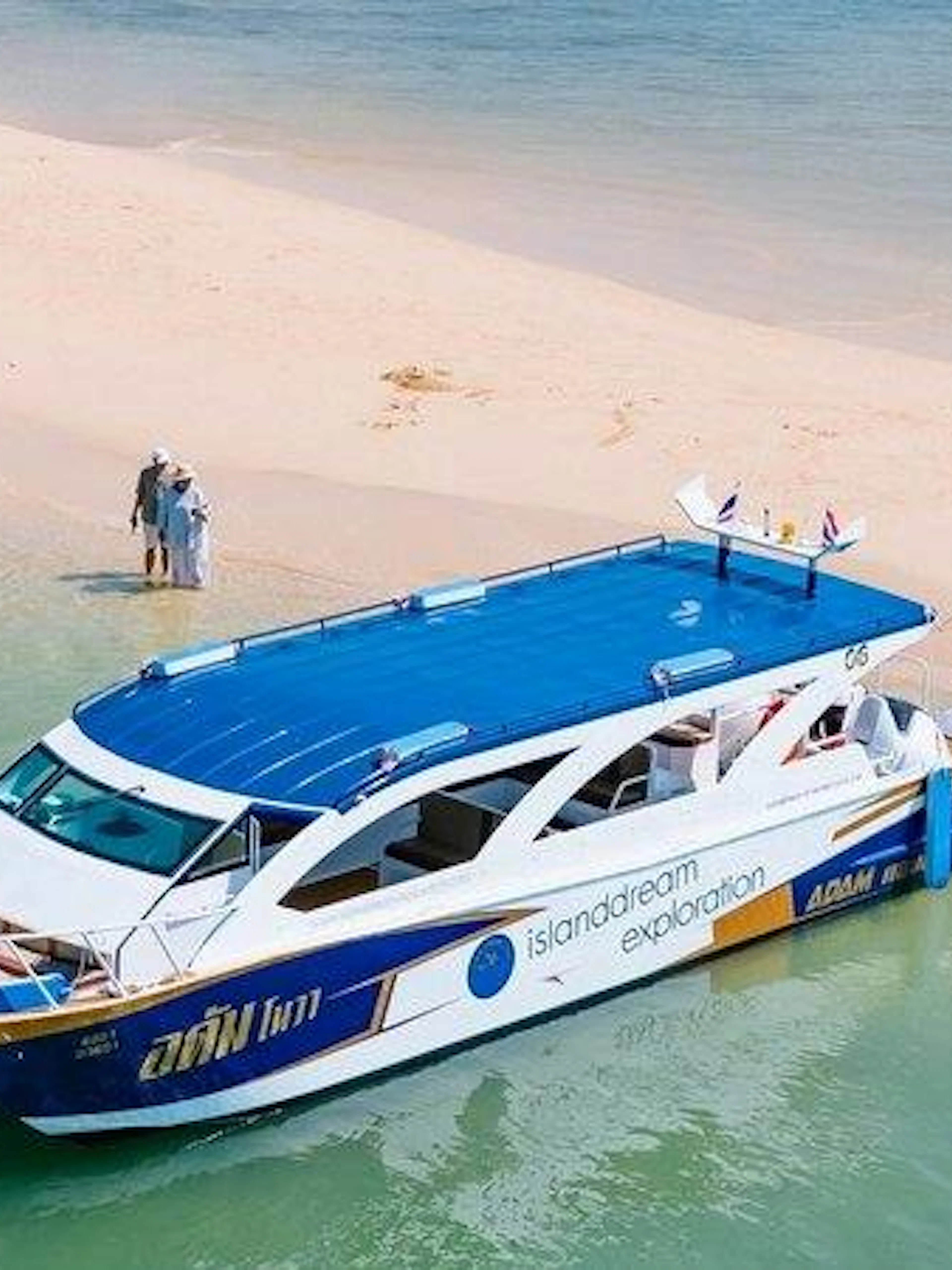Catamaran anchored at a sandy beach during Phi Phi and Maya Bay Islands tour from Khao Lak.