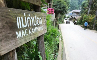 Mae Kampong village road with wooden sign, Chiang Mai tour.