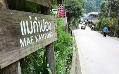 Mae Kampong village road with wooden sign, Chiang Mai tour.