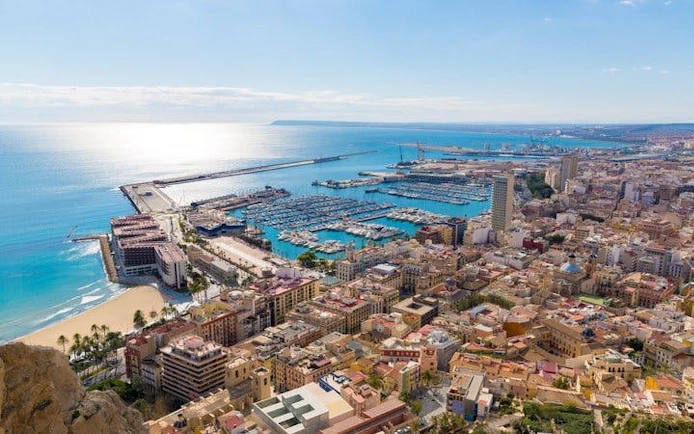 Alicante cityscape with marina and coastline, view from above for self-guided walking tour.