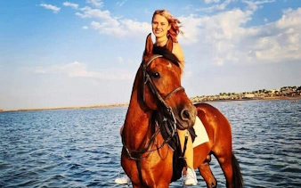 Horseback riding in the Red Sea near Hurghada, Egypt.