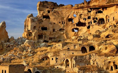 Ancient rock formations and cave dwellings in Cappadocia, Turkey.