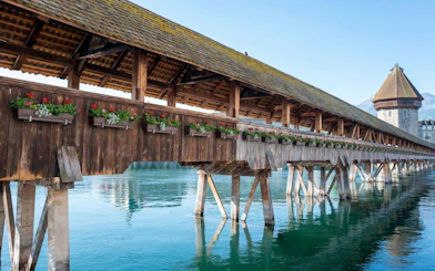 Chapel Bridge over Reuss River in Lucerne Old Town, part of self-guided audio walking tour.