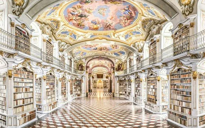 Admont Abbey library interior with ornate ceiling frescoes, part of Salzburg to Hallstatt day trip.