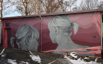 Reykjavik mural of two women on a building wall during a street art walking tour.