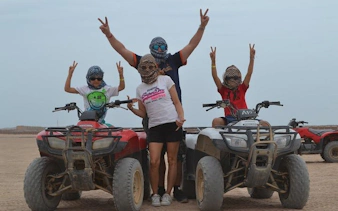 Group on quad bikes during desert safari in Sharm El Sheikh.