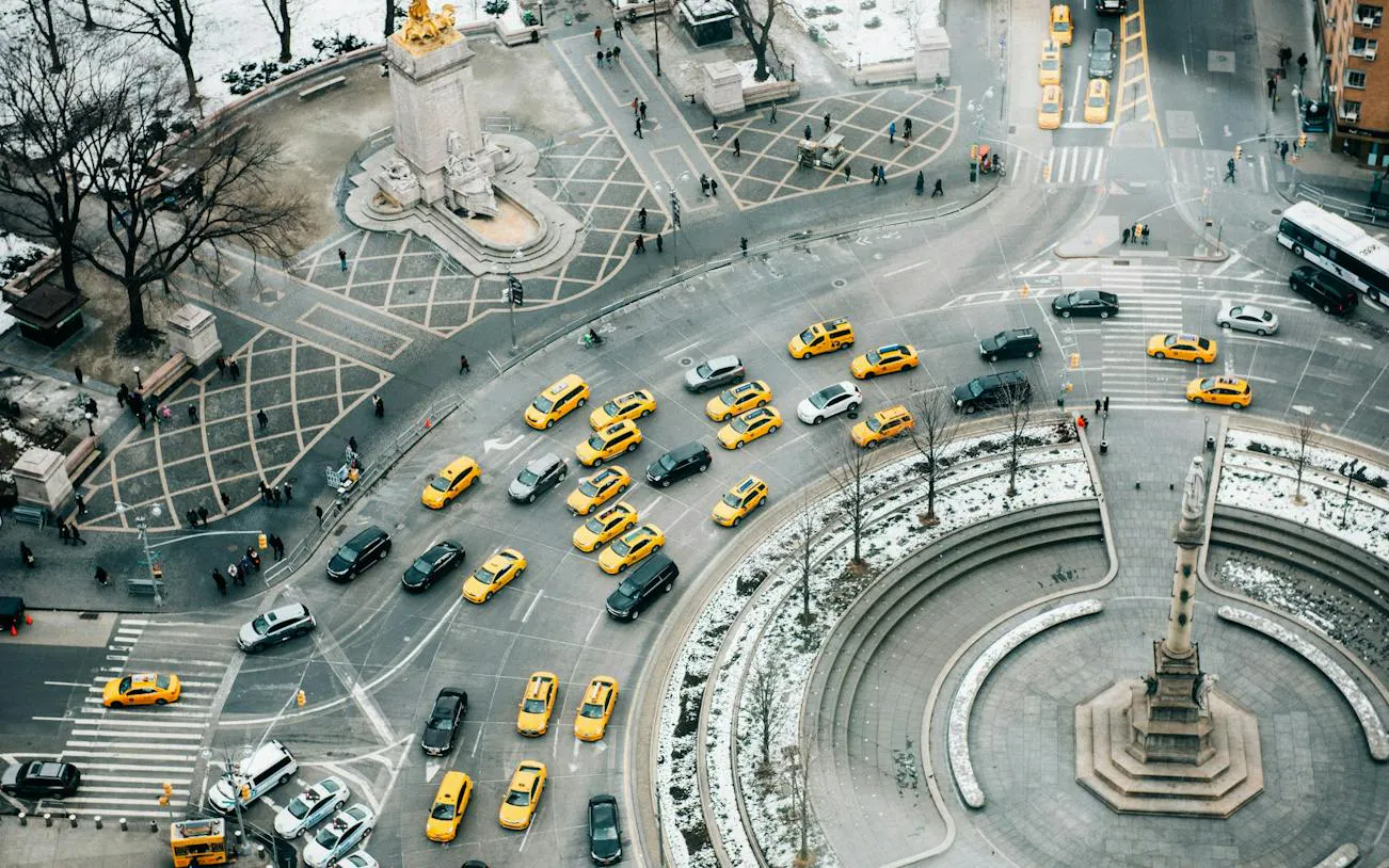 Aerial view of Columbus Circle with yellow taxis near Central Park, New York.