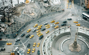 Aerial view of Columbus Circle with yellow taxis near Central Park, New York.