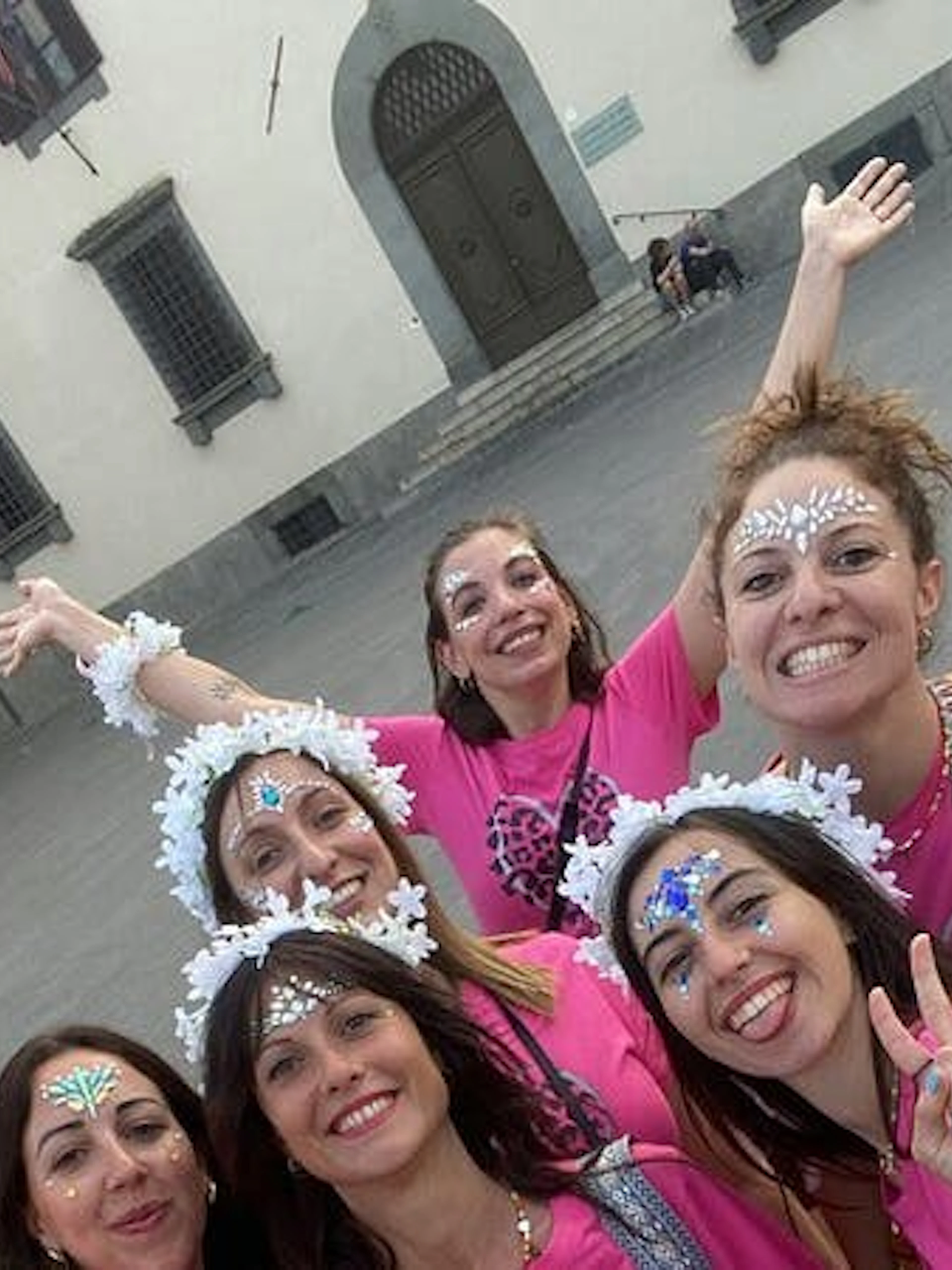 Group enjoying a self-guided city exploration game in Pisa, Italy.