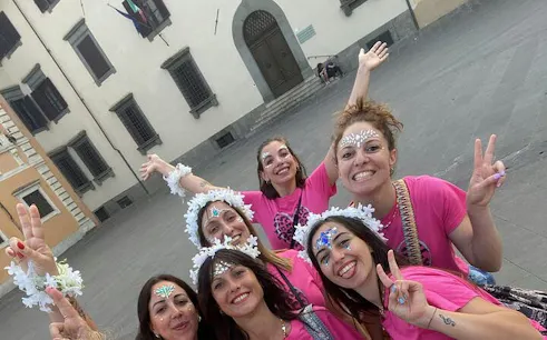 Group enjoying a self-guided city exploration game in Pisa, Italy.
