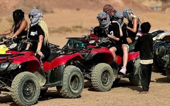 Quad biking group in Sharm El Sheikh desert with guide.