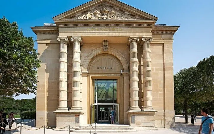 Musée de l'Orangerie entrance in Paris with visitors outside.