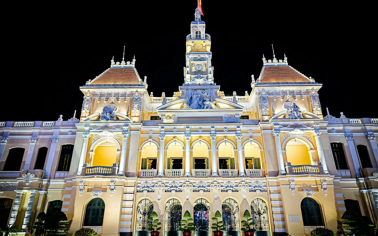 Ho Chi Minh City Hall illuminated at night, French colonial architecture, Ho Chi Minh City.