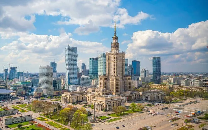 Warsaw skyline featuring the Palace of Culture and Science, part of Muranów exploration game.