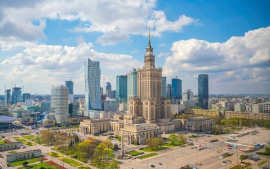 Warsaw skyline featuring the Palace of Culture and Science, part of Muranów exploration game.