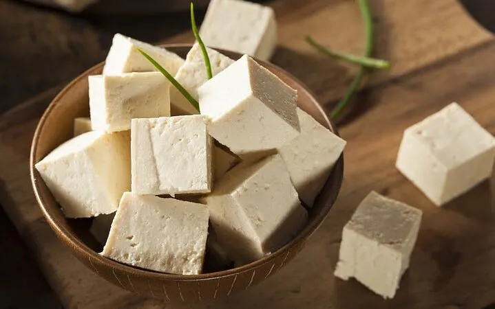 Tofu cubes in a bowl, part of Sa Pa cooking class using local Vietnamese ingredients.