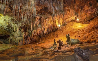 Cave interior with stalactites and stalagmites on Sapa Nature Day Trip.