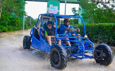 Off-road buggy driving through water in Punta Cana adventure tour.