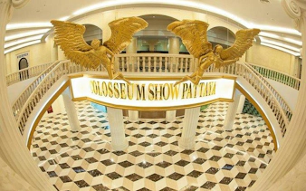 Colosseum Show Pattaya entrance with golden statues, Pattaya.
