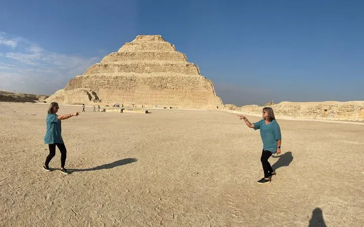 Step Pyramid of Djoser in Egypt with tourists exploring the site.