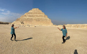Step Pyramid of Djoser in Egypt with tourists exploring the site.
