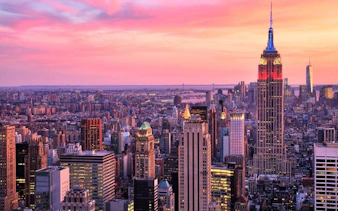 New York skyline with Empire State Building at sunset for self-guided walking tour app.