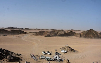 Family buggy cars and tourists in desert landscape, Sharm El Sheikh safari.
