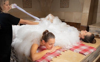 Turkish bath massage with foam in Hurghada spa.