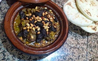 Moroccan tagine with prunes and pine nuts served with flatbread during Essaouira city tour cooking class.