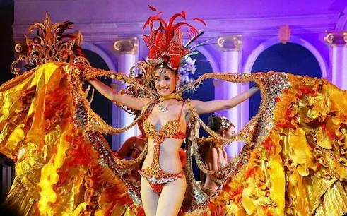 Performer in vibrant costume at Golden Dome Cabaret, Bangkok.