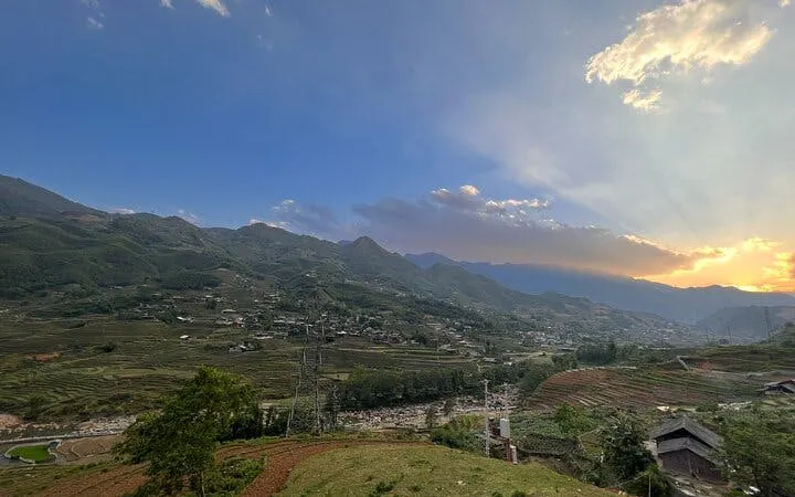 Sapa rice fields and villages at sunset during motorbike tour, Vietnam.